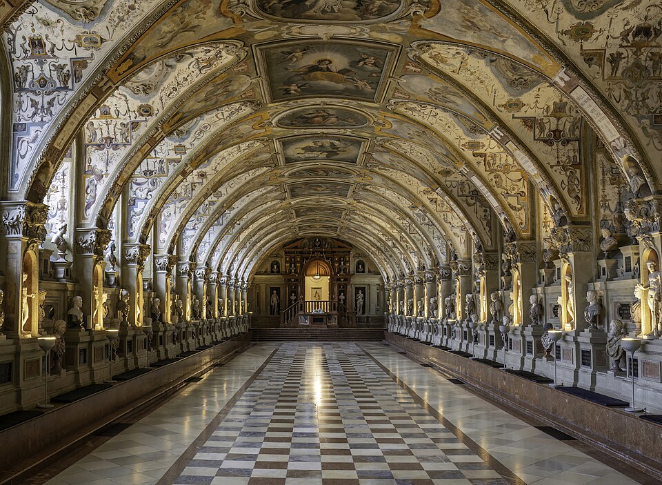 The long barrel-vaulted Antiquarium hall of the Munich Residenz with frescoes.